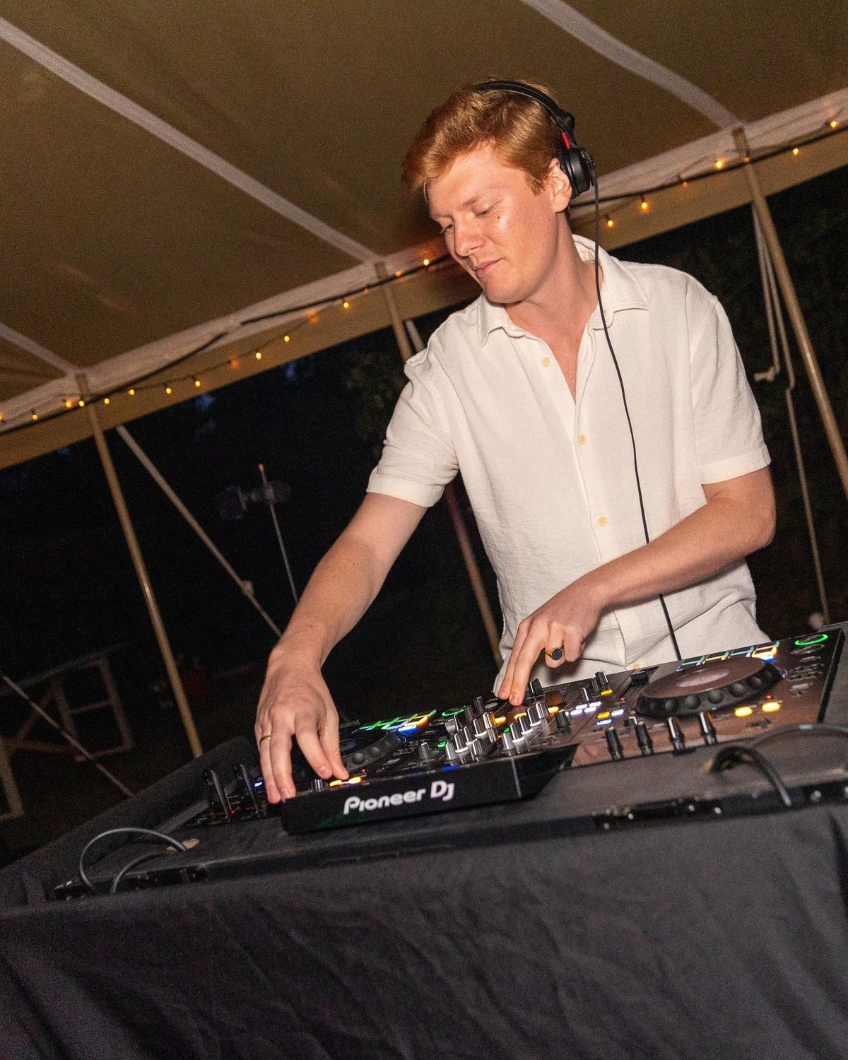 DJ Surleau behind the decks during a party